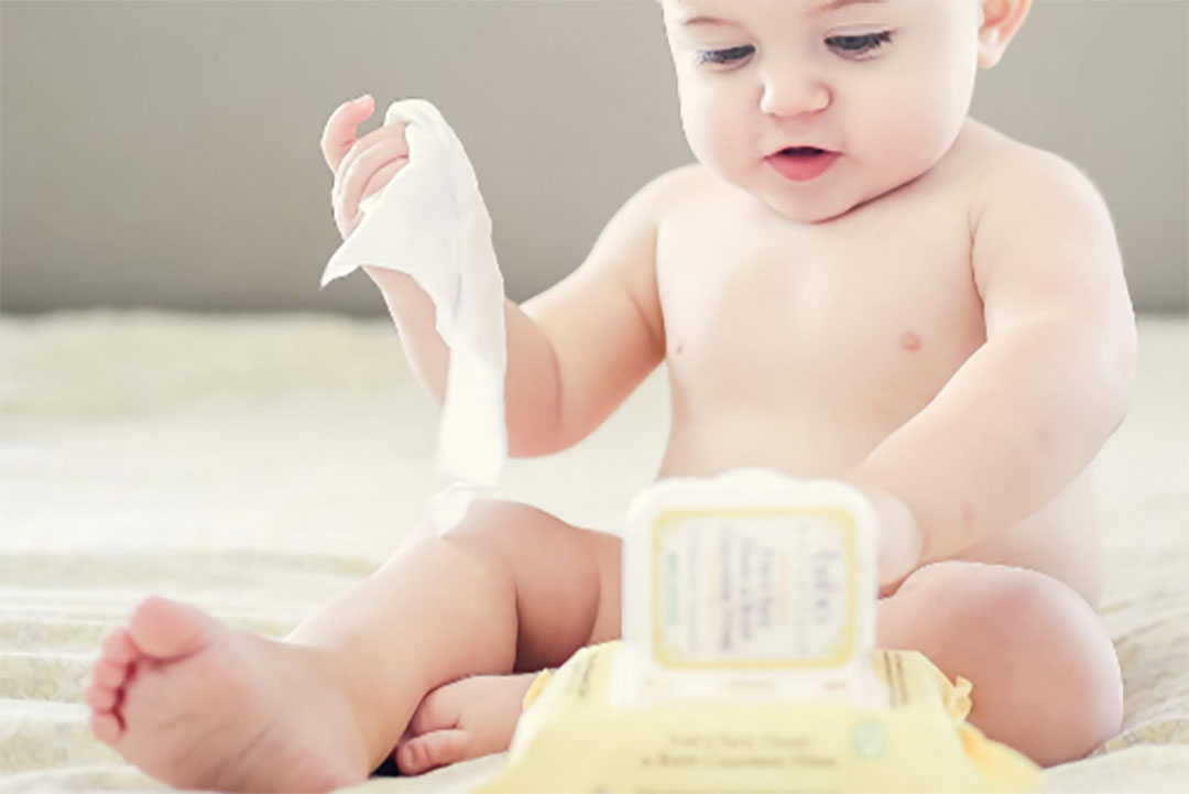 Baby is using baby water wipes