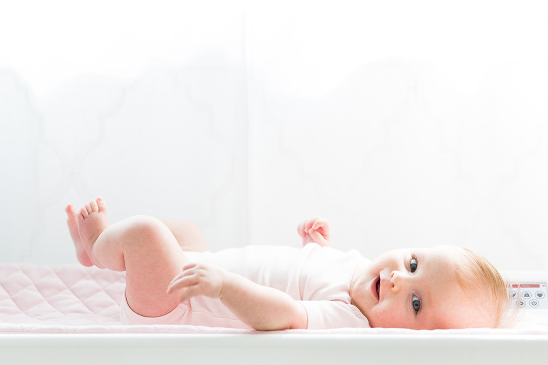 Baby was lying on the diaper changing mats